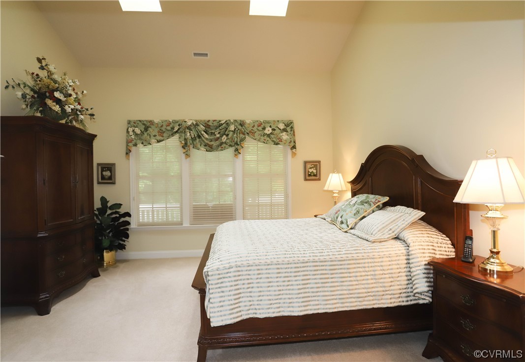 4748 Westhampton Williamsburg, VA 23188 - Photo 24 of 39 a bedroom with a bed and a lamp