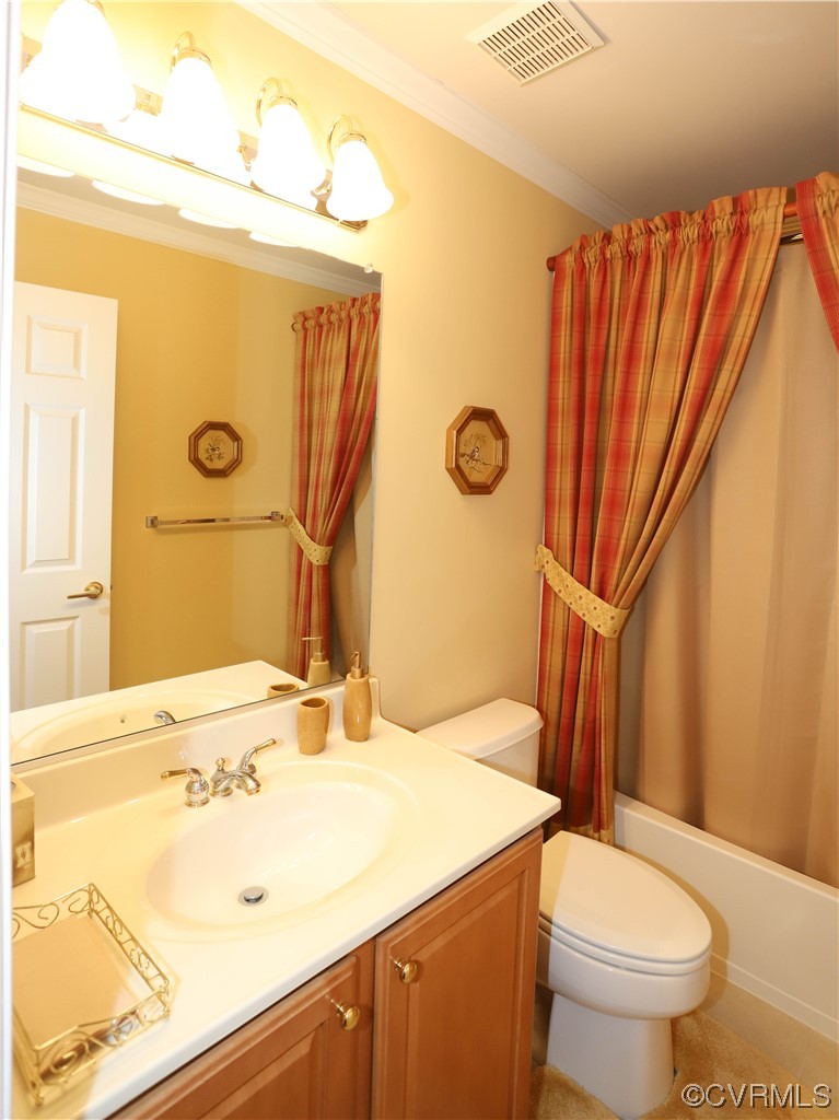 4748 Westhampton Williamsburg, VA 23188 - Photo 28 of 39 a bathroom with a sink a toilet and shower curtain