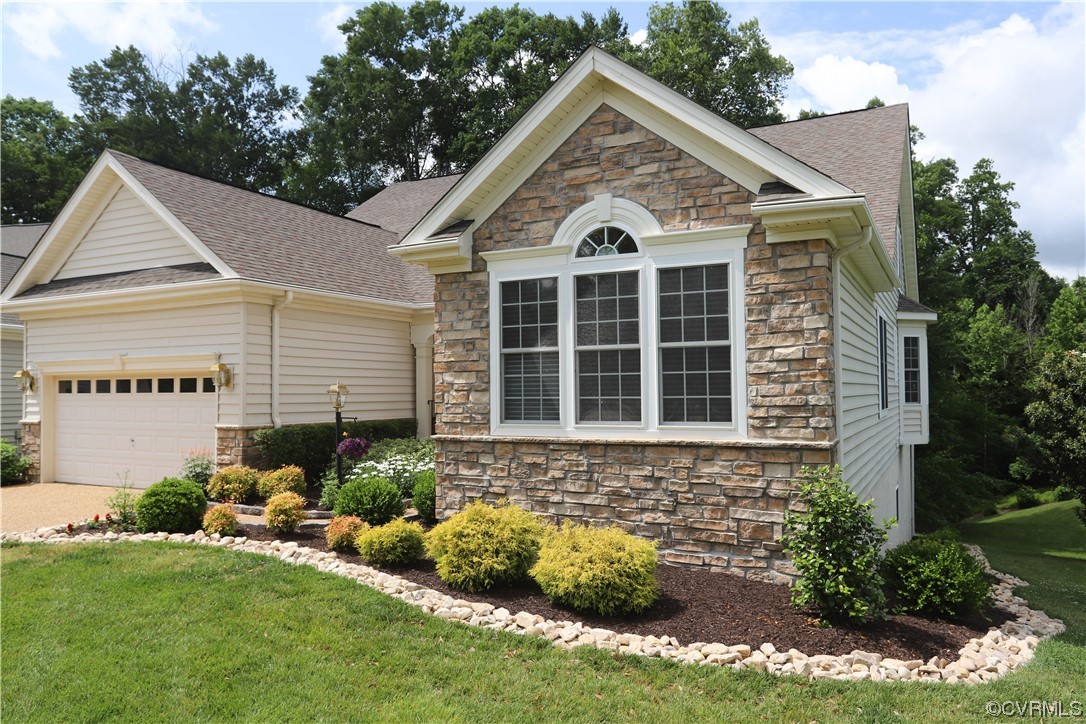 4748 Westhampton Williamsburg, VA 23188 - Photo 4 of 39 a front view of a house with a yard and garage