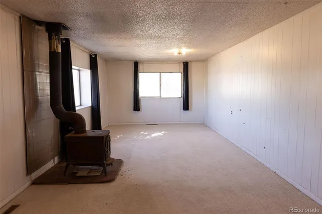 a view of a livingroom with furniture and windows