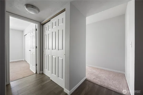 a bathroom with a granite countertop sink a toilet and shower