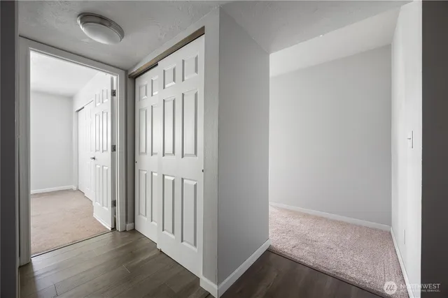 a bathroom with a granite countertop sink a toilet and shower