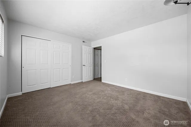 a view of a bathroom with a glass door