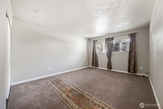 an empty room with closet area