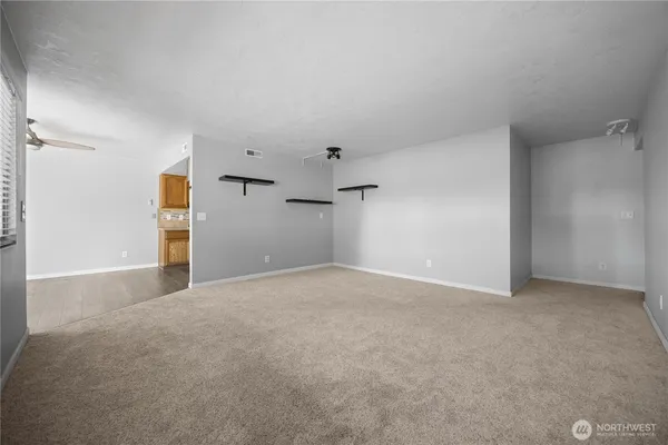 a view of an empty room with windows