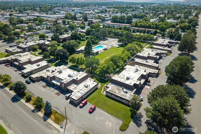 an aerial view of residential houses with outdoor space