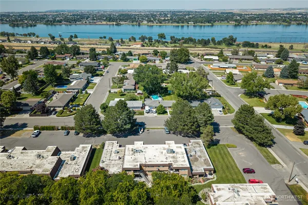 an aerial view of residential building with lake view