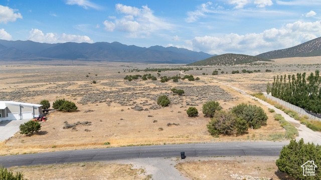2974 West Ridgeline Road, Unit 85 Stockton, UT 84071 - Photo 2 of 23 View of mountain backdrop with rural landscape and a desert landscape