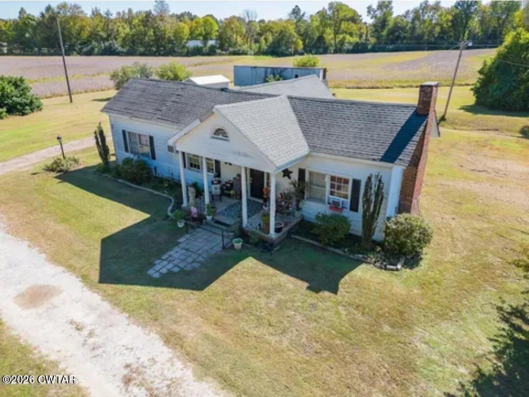 a aerial view of a house with a yard