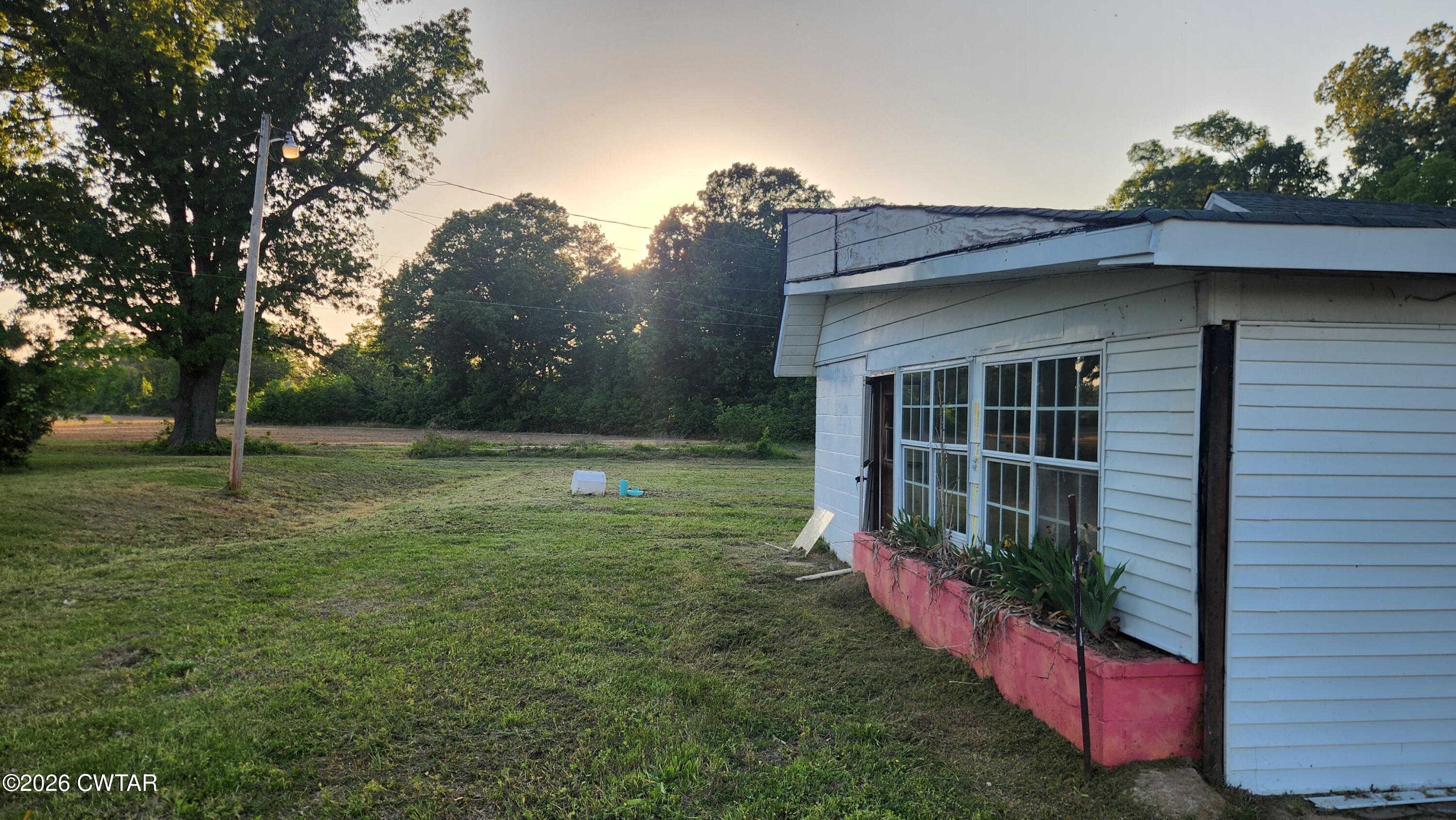 8633 Stanton Koko Road Stanton, TN 38069 - Photo 9 of 10 a view of a house with a yard