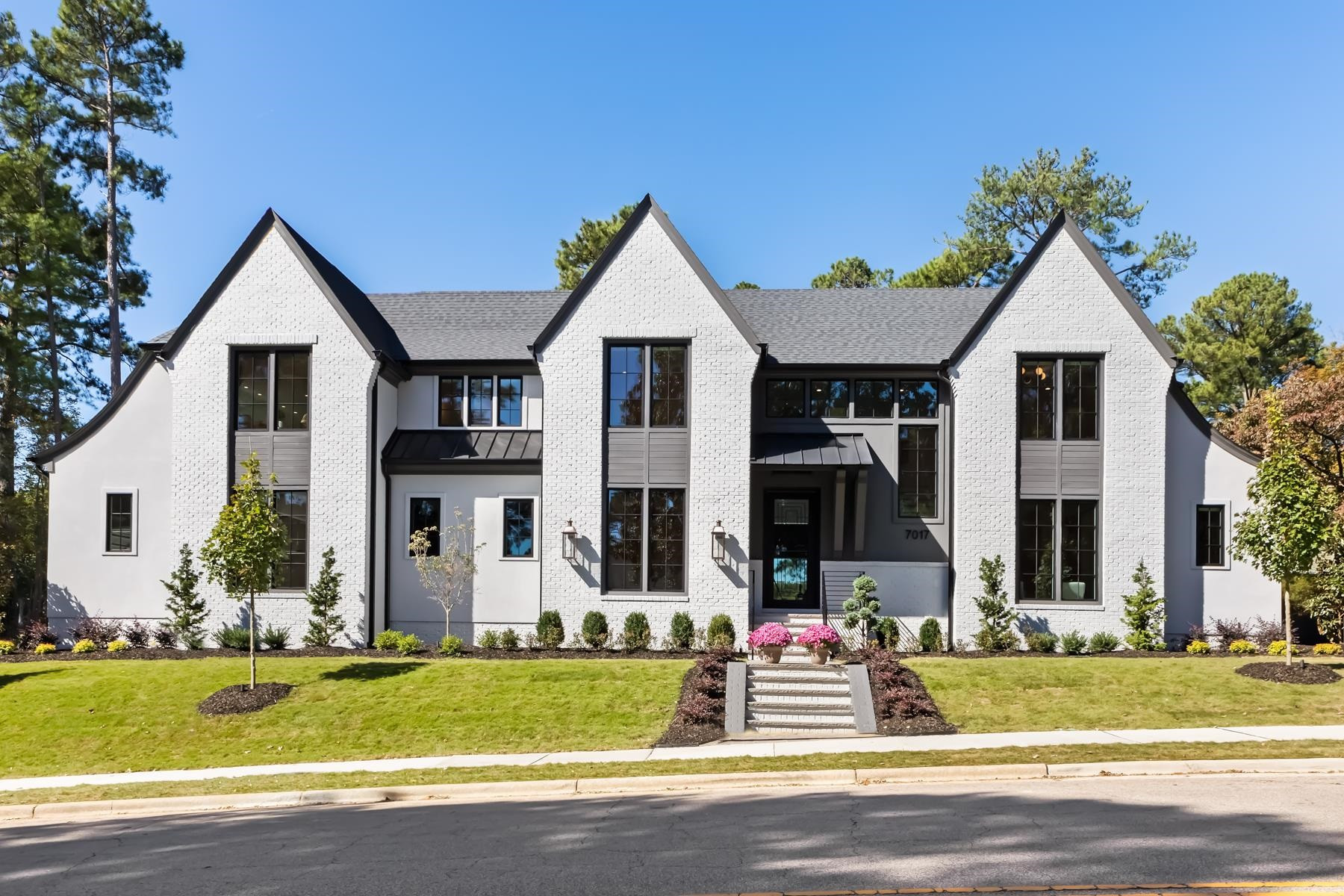 a front view of house with yard and green space
