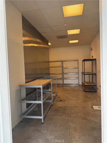 a view of a hallway view with floor to ceiling window and entryway