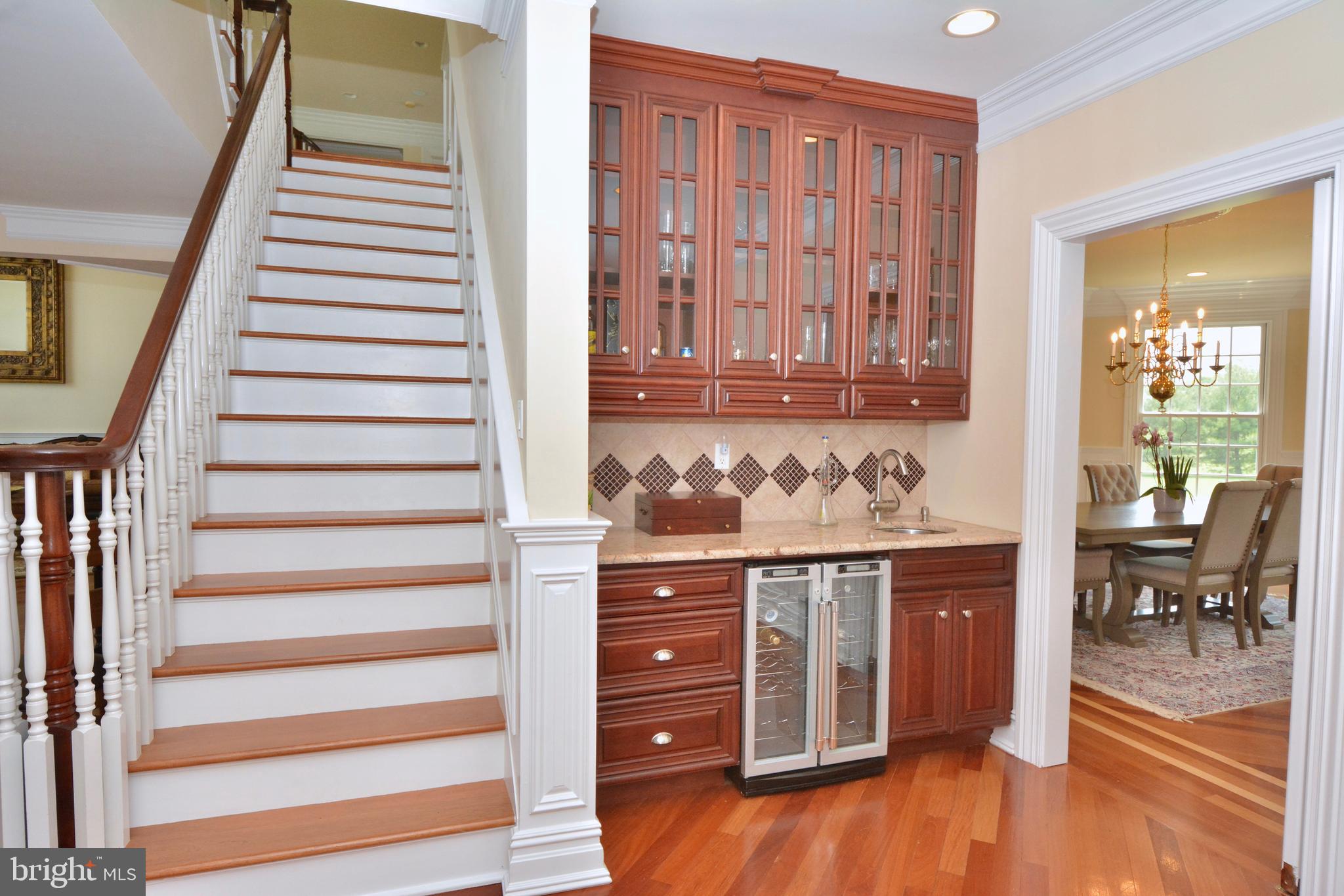 8 Silvers Court Pennington, NJ 08534 - Photo 21 of 43 Back stairs with beverage bar off dining room.