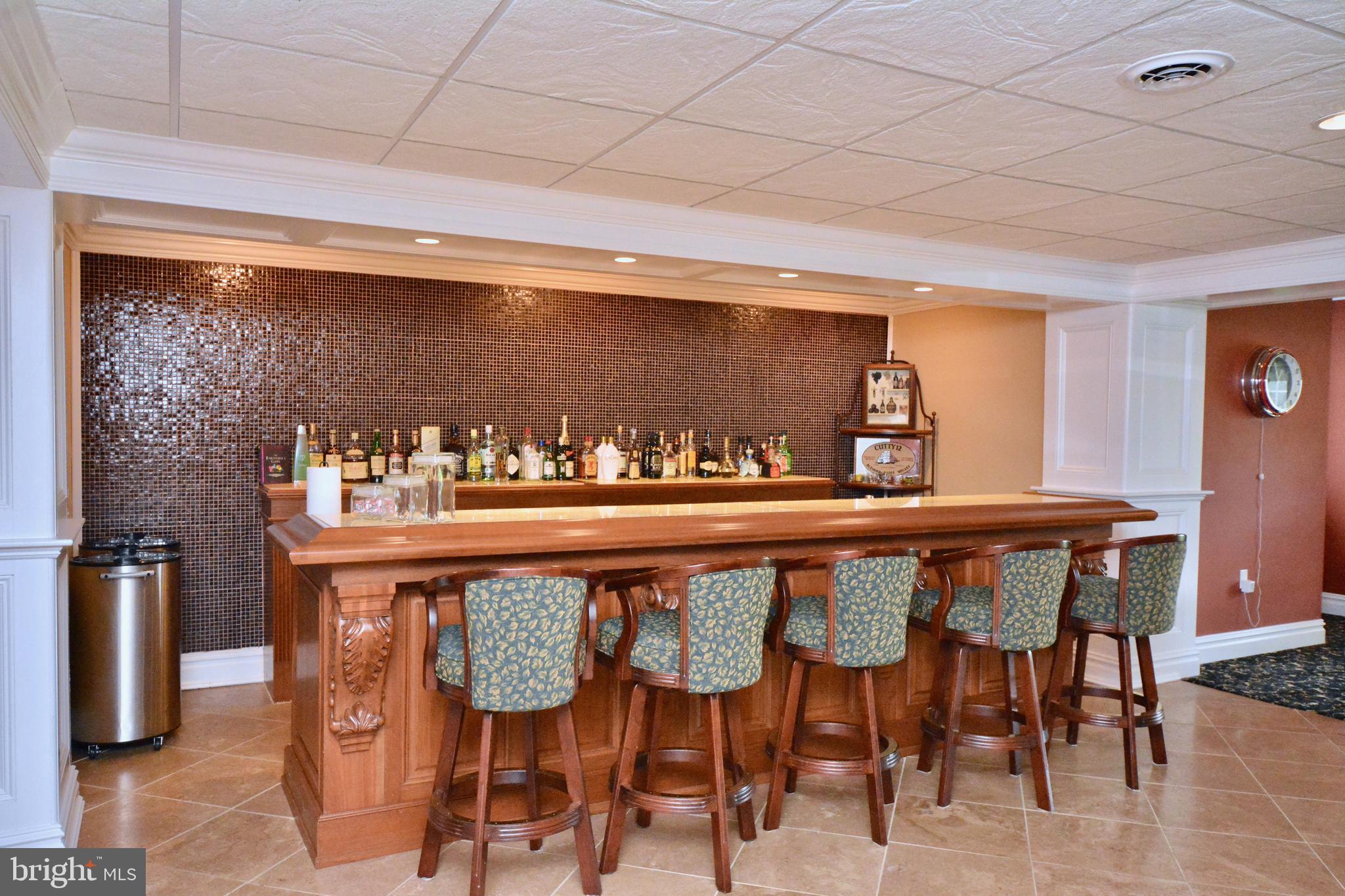 8 Silvers Court Pennington, NJ 08534 - Photo 34 of 43 Custom bar: glass mosaic tile wall & onyx counters
