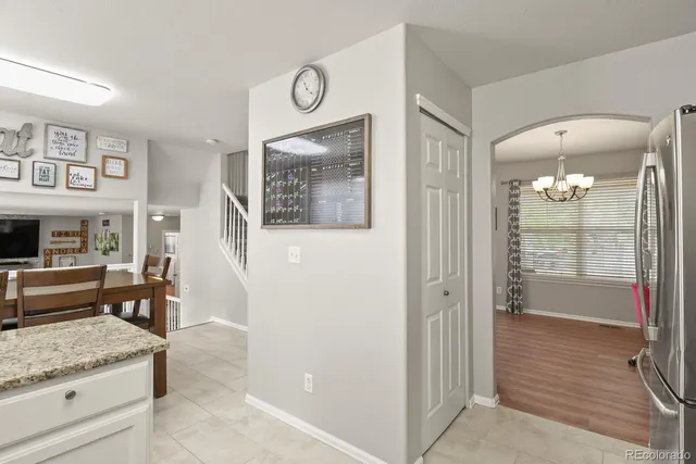 a view of a hallway with furniture and a livingroom view