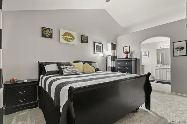 a bed room with a bed and a tv