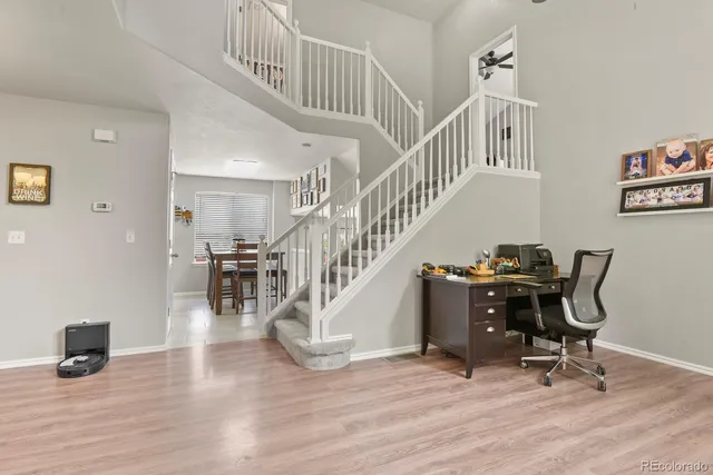 a view of entryway livingroom and hall with wooden floor
