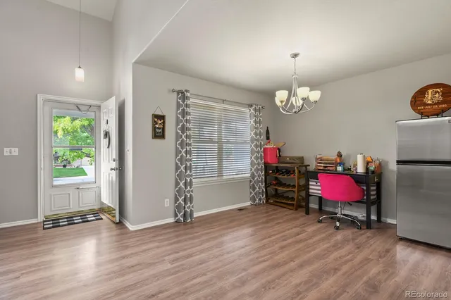 a room with furniture and wooden floor
