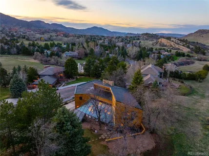 an aerial view of a house with mountain view