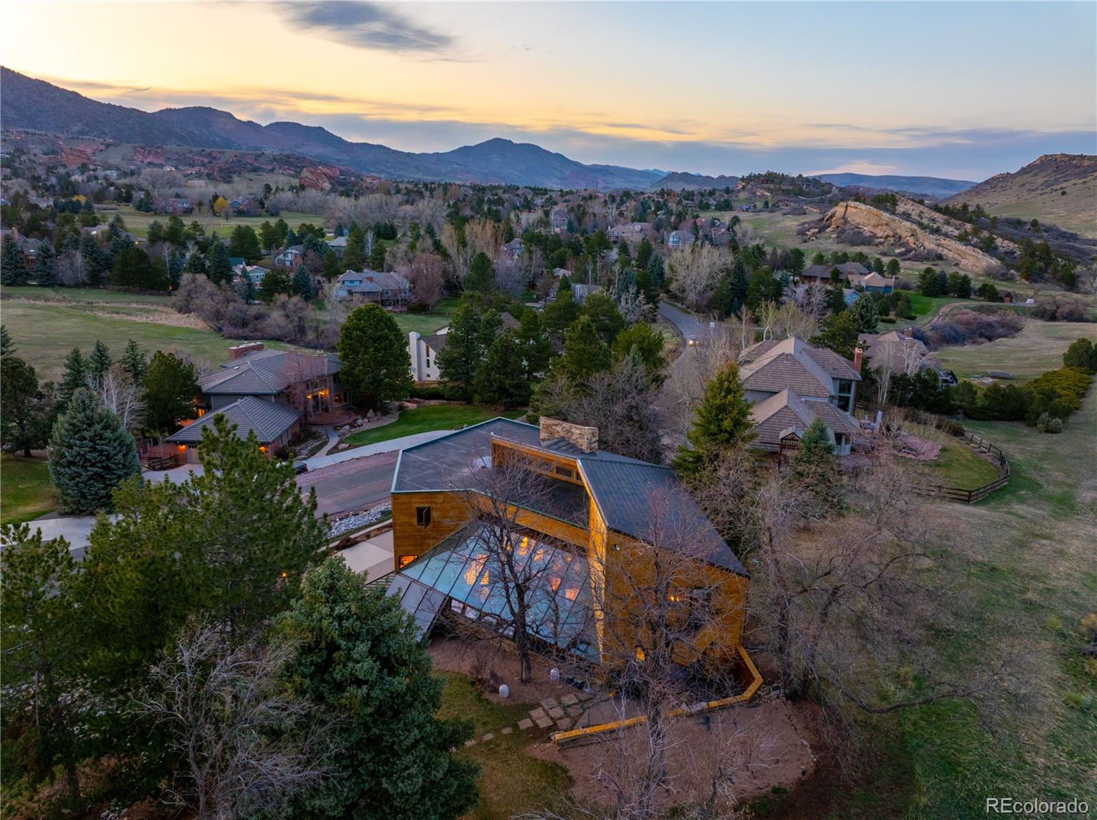 an aerial view of a house with mountain view