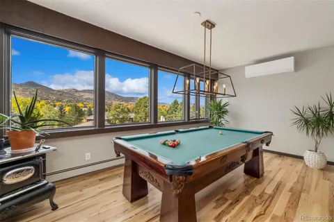 a view of a swimming pool with furniture