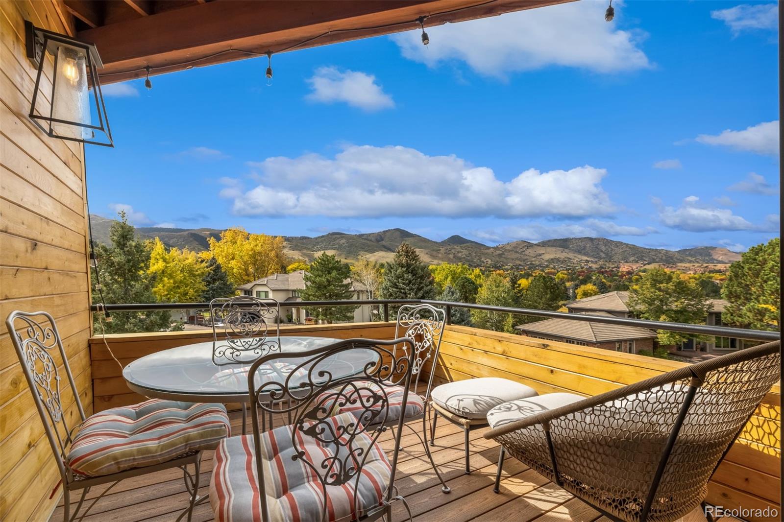 6 Blue Grouse Ridge Road Littleton, CO 80127 - Photo 24 of 50 a view of a swimming pool with a lounge chair