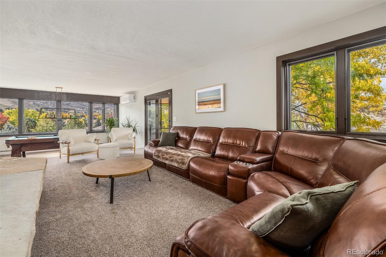 6 Blue Grouse Ridge Road Littleton, CO 80127 - Photo 26 of 50 a living room with furniture and a large window
