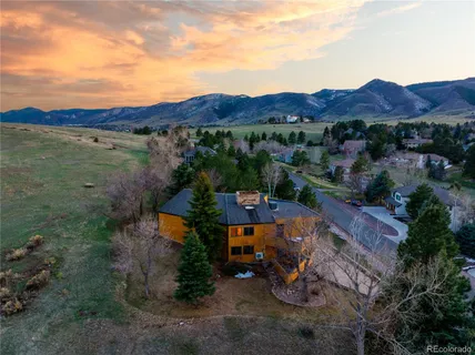 an aerial view of a house with mountain view
