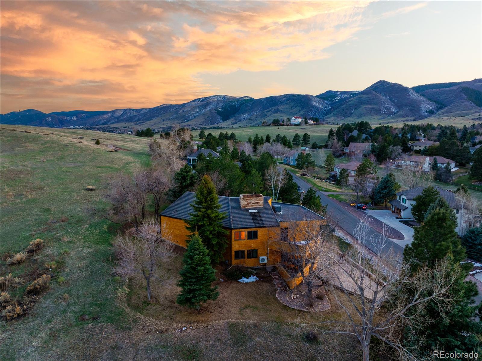 6 Blue Grouse Ridge Road Littleton, CO 80127 - Photo 3 of 50 an aerial view of a house with mountain view