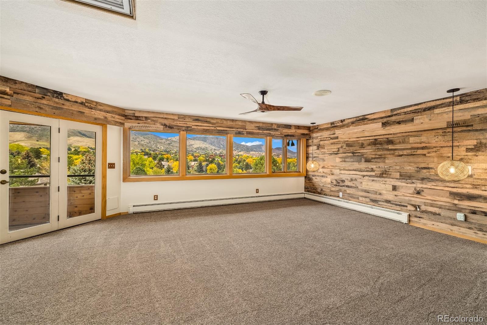 6 Blue Grouse Ridge Road Littleton, CO 80127 - Photo 31 of 50 a view of an empty room with a window