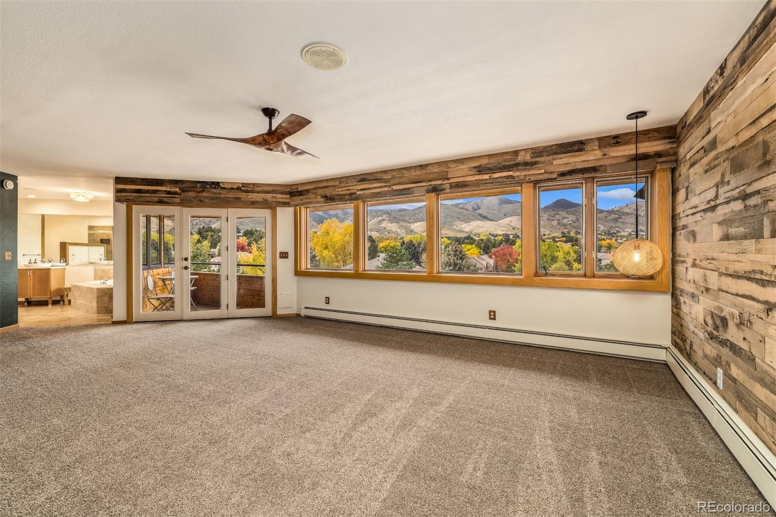6 Blue Grouse Ridge Road Littleton, CO 80127 - Photo 32 of 50 wooden floor in an empty room with a window