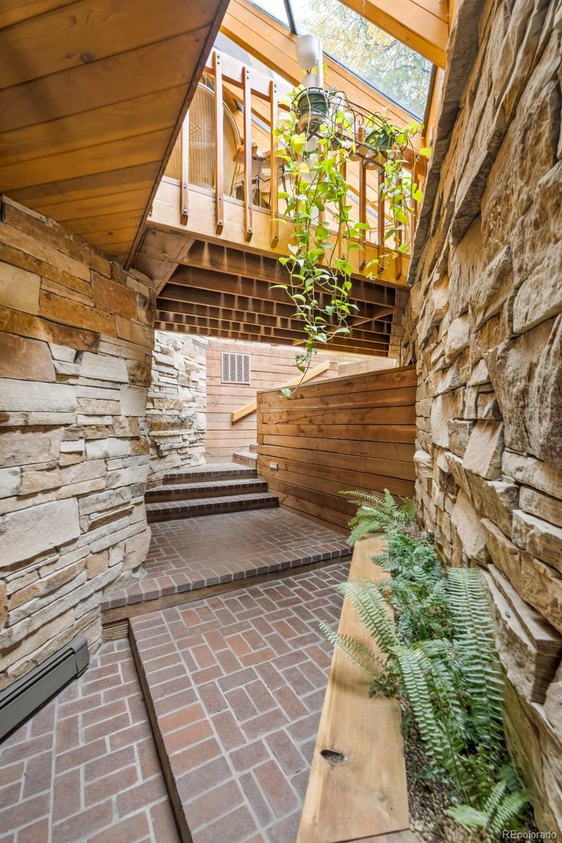 6 Blue Grouse Ridge Road Littleton, CO 80127 - Photo 4 of 50 a view of a pathway both side of building