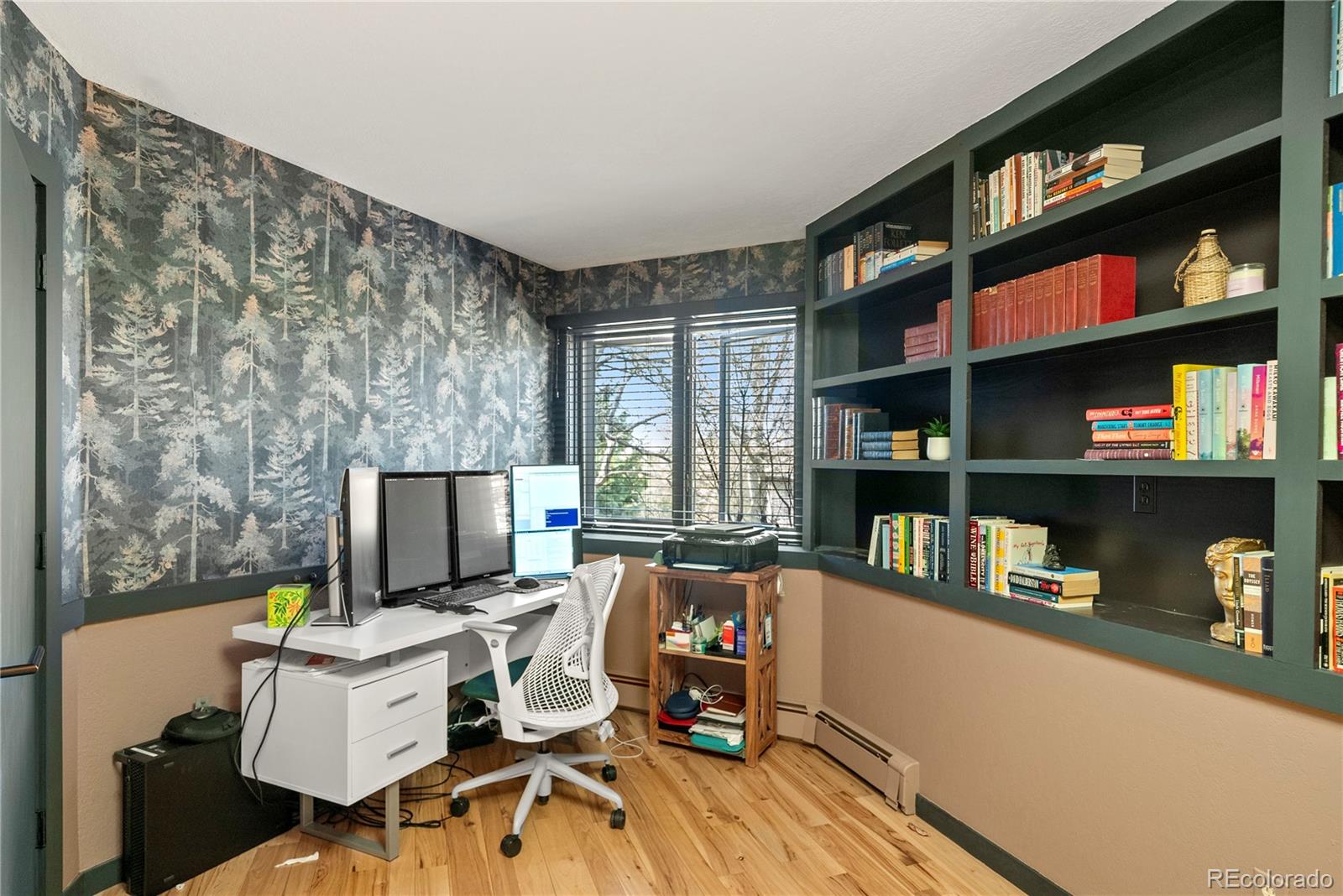6 Blue Grouse Ridge Road Littleton, CO 80127 - Photo 41 of 50 a view of a workspace with furniture and a kitchen