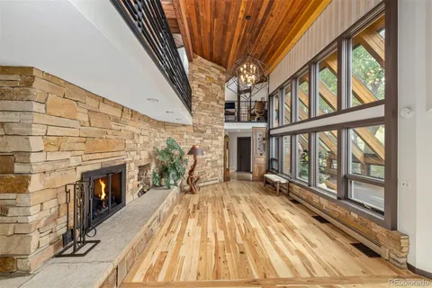 a view of an entryway with wooden floor