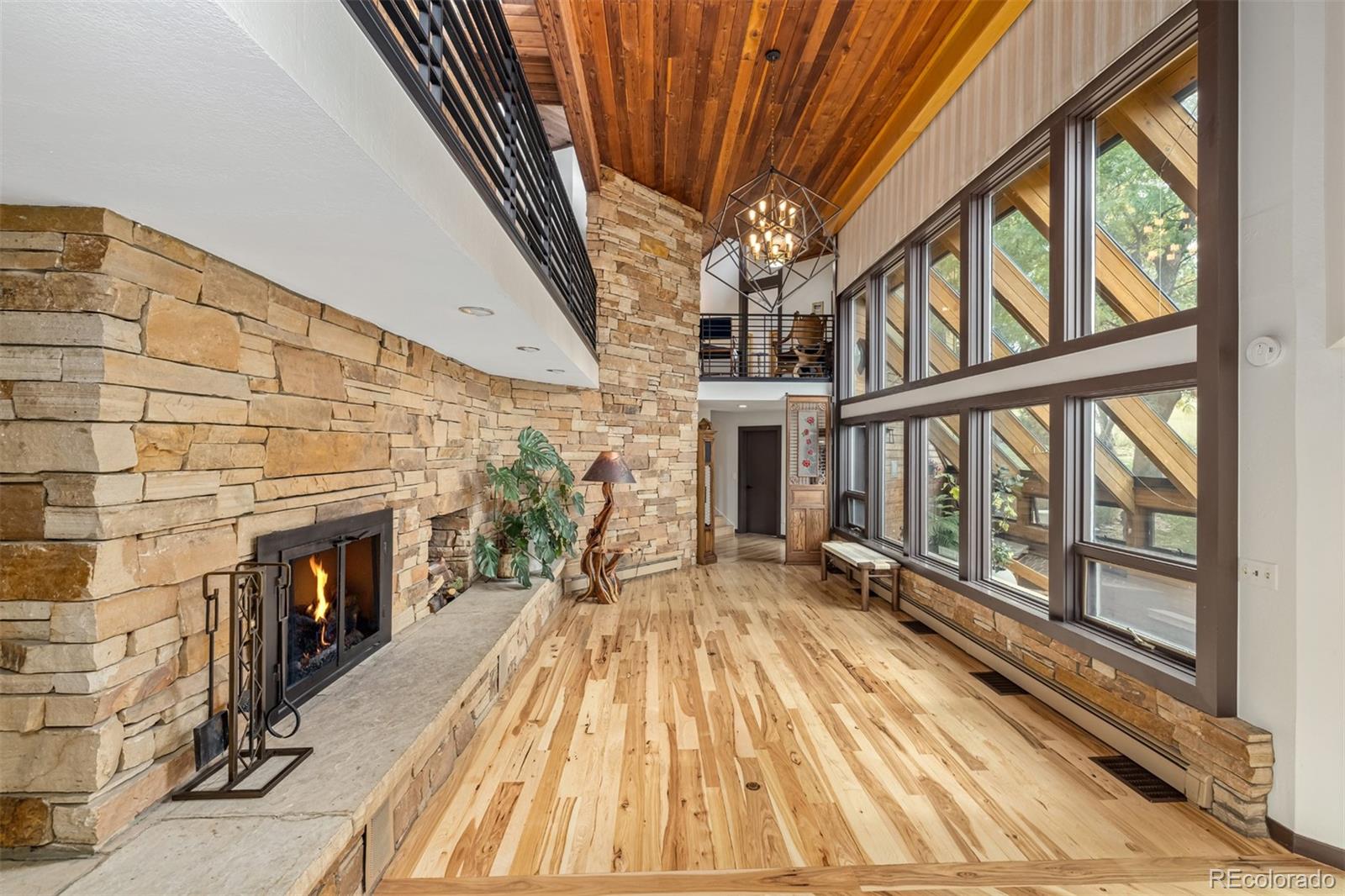 6 Blue Grouse Ridge Road Littleton, CO 80127 - Photo 10 of 50 a view of an entryway with wooden floor