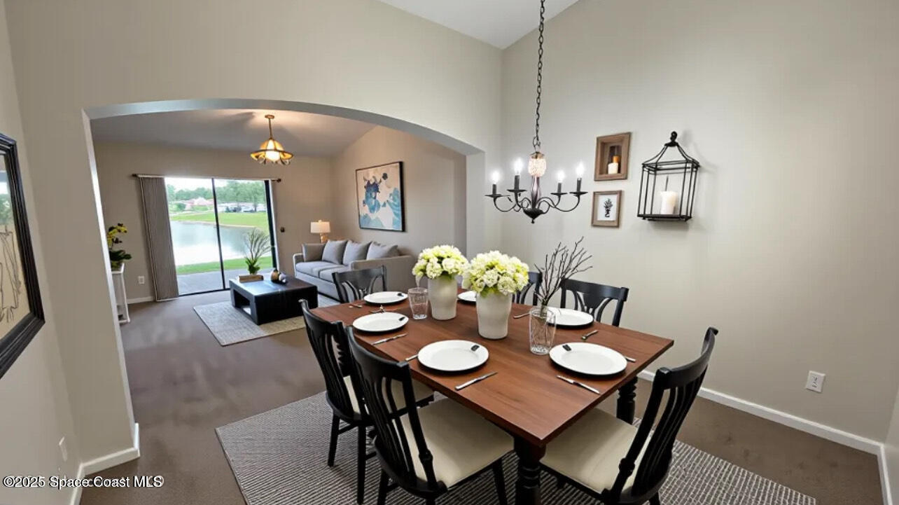 975 Luminary Circle, Unit 103 Melbourne, FL 32901 - Photo 10 of 70 a view of a dining room with furniture and wooden floor