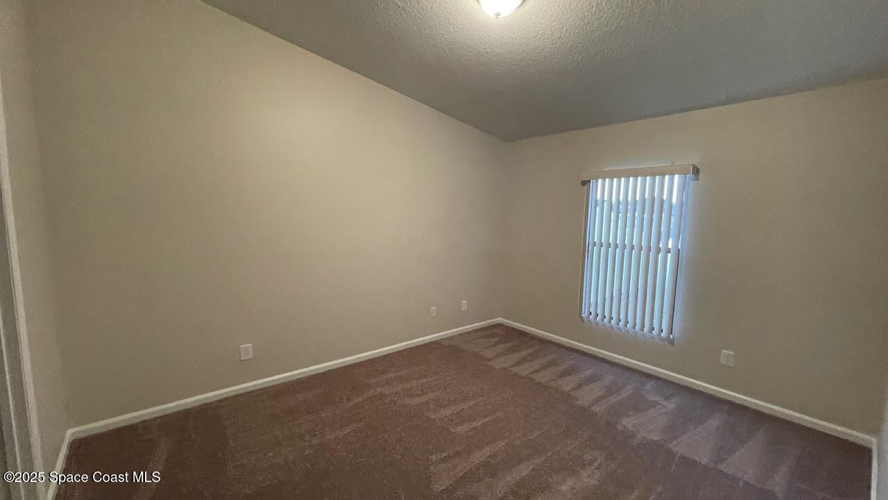 975 Luminary Circle, Unit 103 Melbourne, FL 32901 - Photo 16 of 70 an empty room with windows