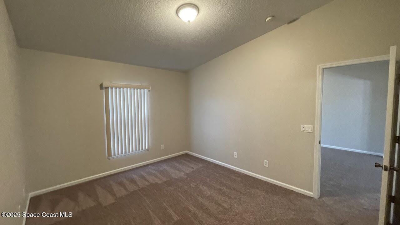 975 Luminary Circle, Unit 103 Melbourne, FL 32901 - Photo 17 of 70 an empty room with windows