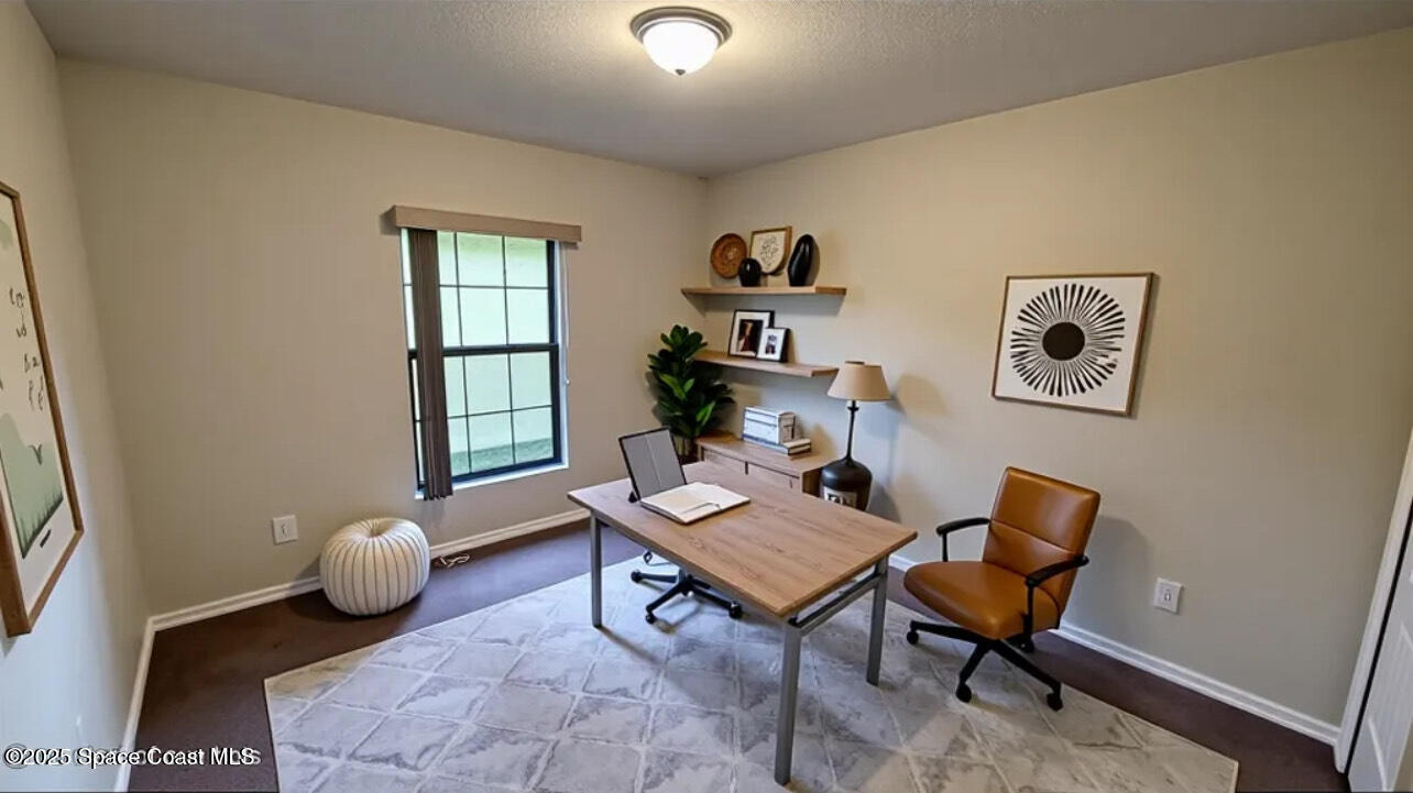 975 Luminary Circle, Unit 103 Melbourne, FL 32901 - Photo 29 of 70 a living room with furniture and a window