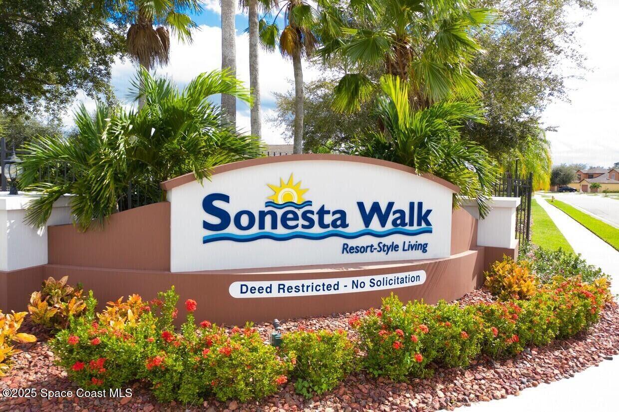 975 Luminary Circle, Unit 103 Melbourne, FL 32901 - Photo 2 of 70 a sign on the side of the road