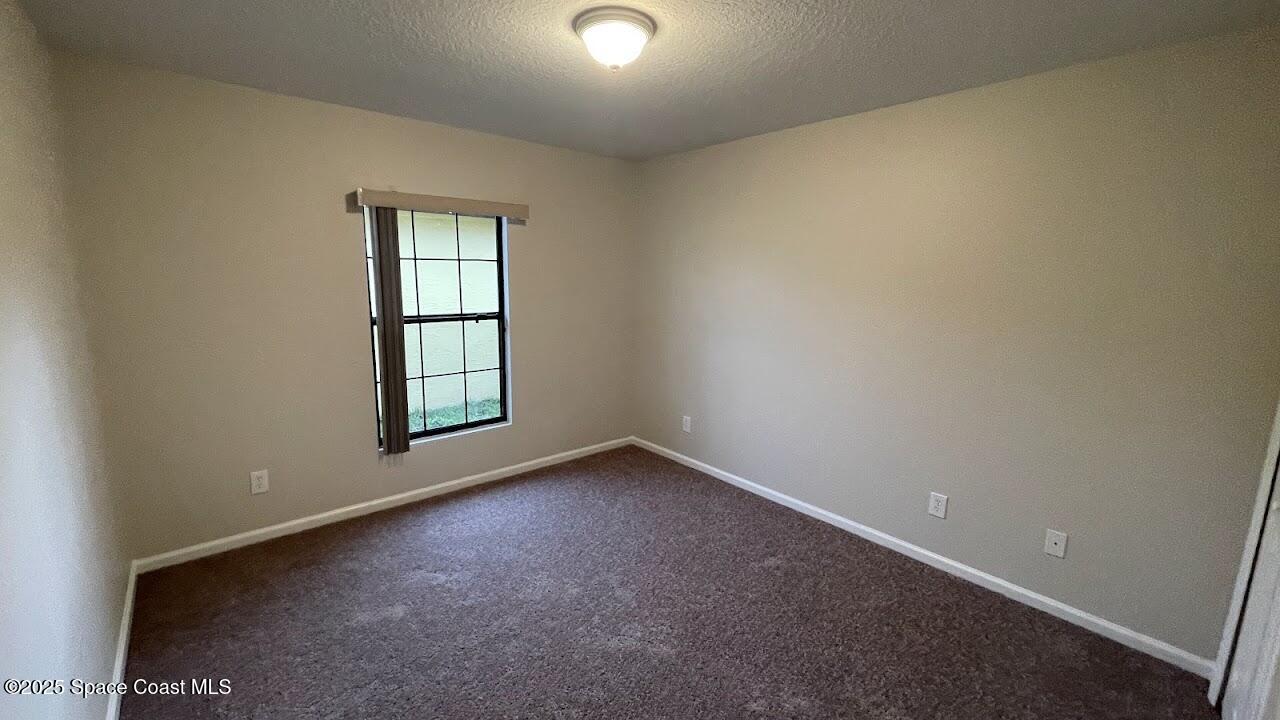 975 Luminary Circle, Unit 103 Melbourne, FL 32901 - Photo 31 of 70 an empty room with windows