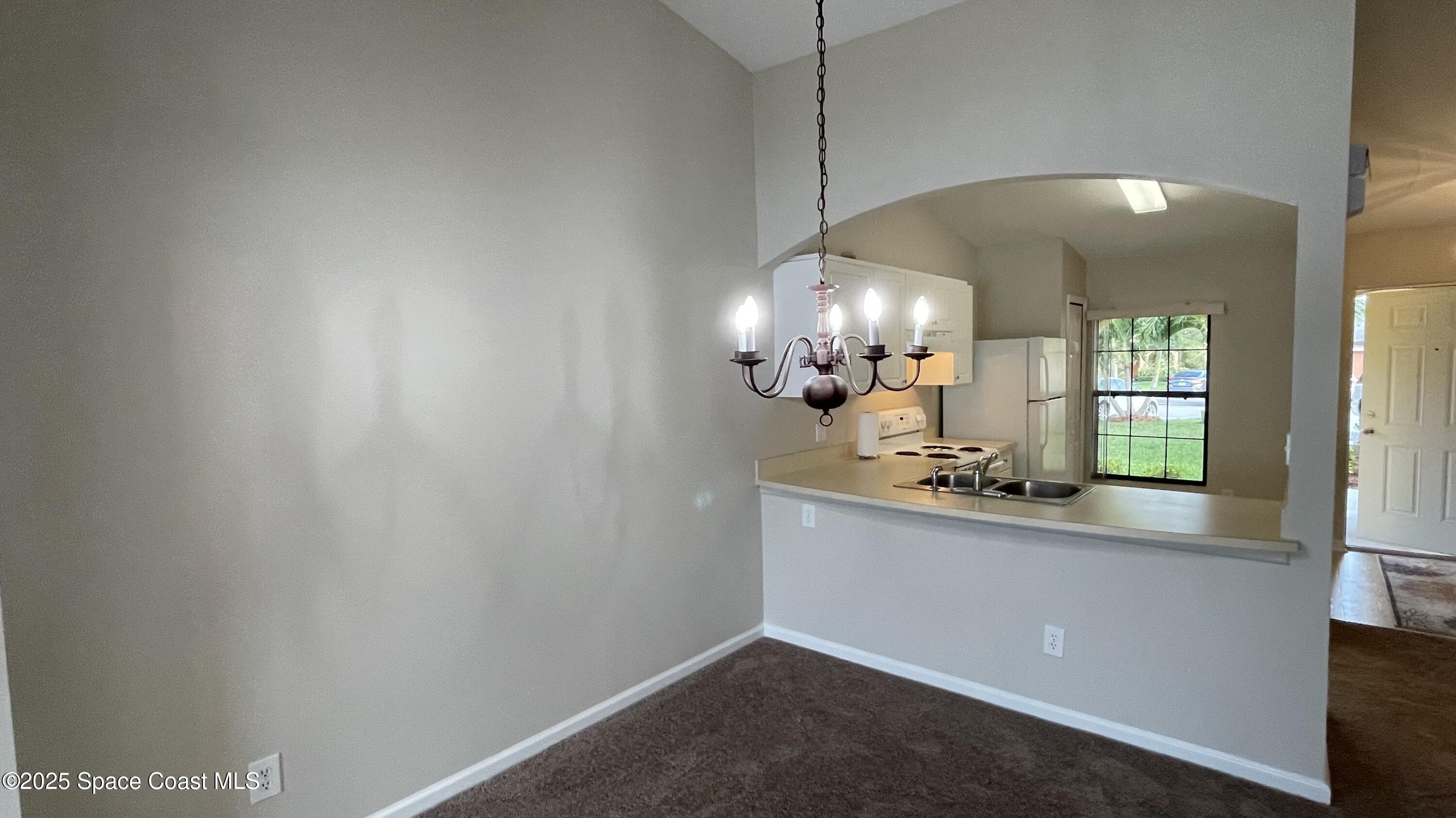 975 Luminary Circle, Unit 103 Melbourne, FL 32901 - Photo 36 of 70 a view of a kitchen with a sink