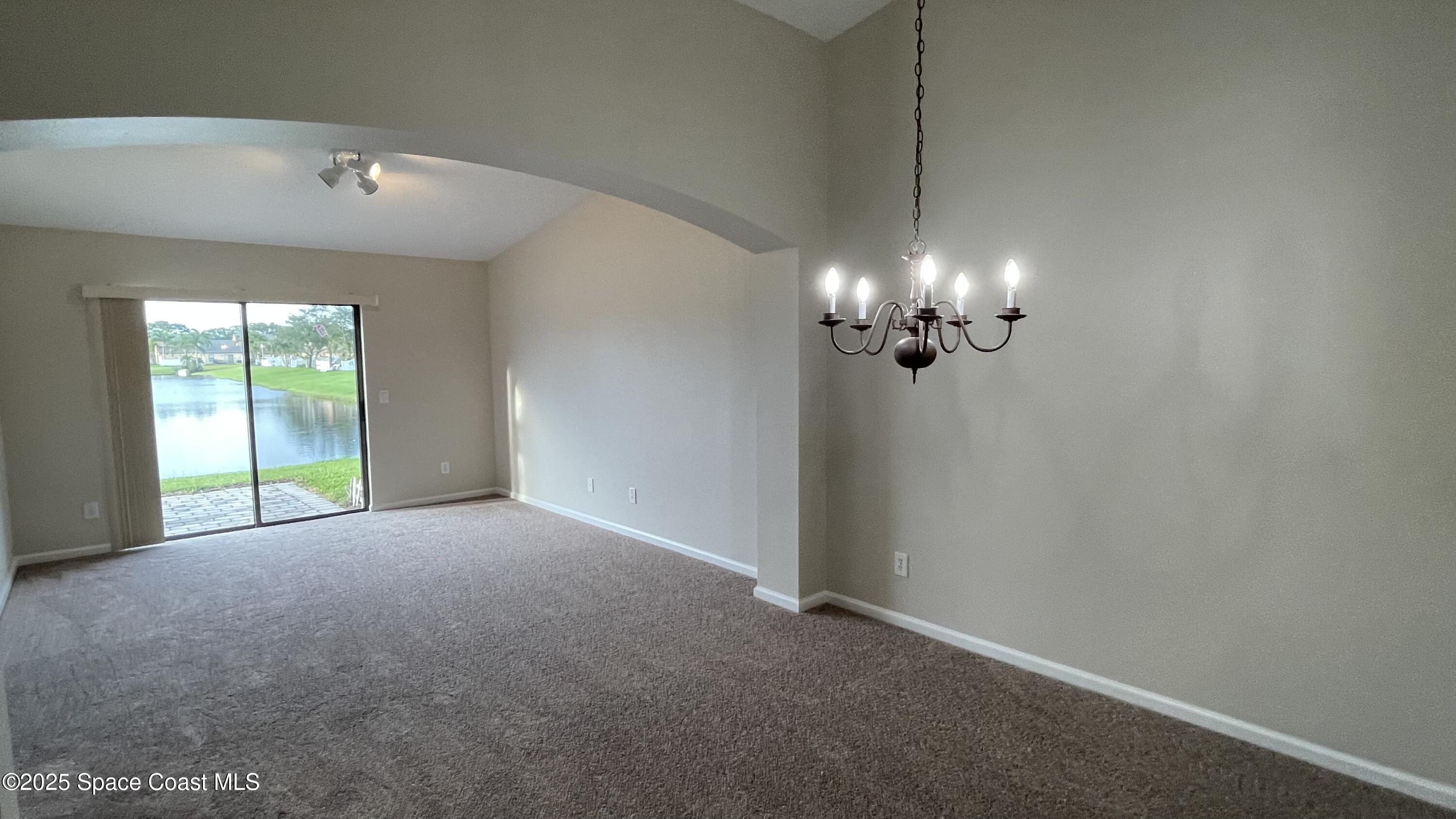 975 Luminary Circle, Unit 103 Melbourne, FL 32901 - Photo 38 of 70 a view of an empty room with a window