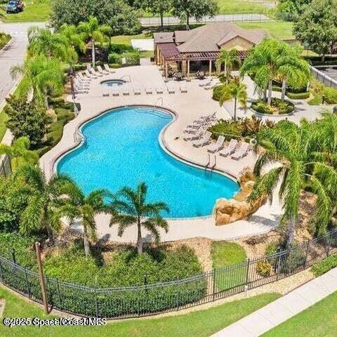 975 Luminary Circle, Unit 103 Melbourne, FL 32901 - Photo 3 of 70 an aerial view of a house with a yard and lake view