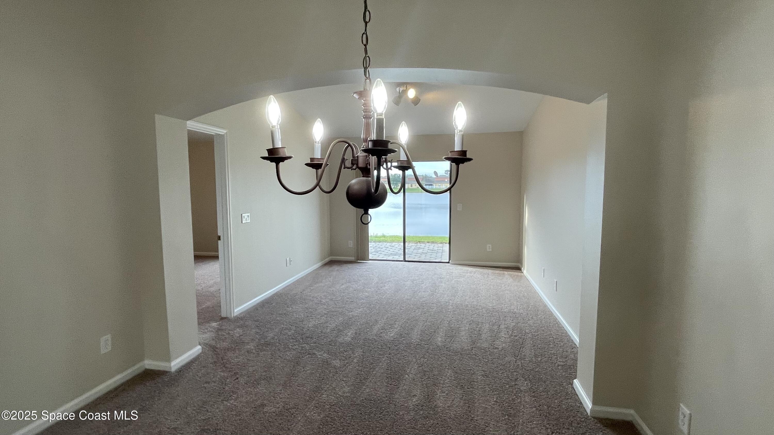 975 Luminary Circle, Unit 103 Melbourne, FL 32901 - Photo 40 of 70 a view of a chandelier in a room