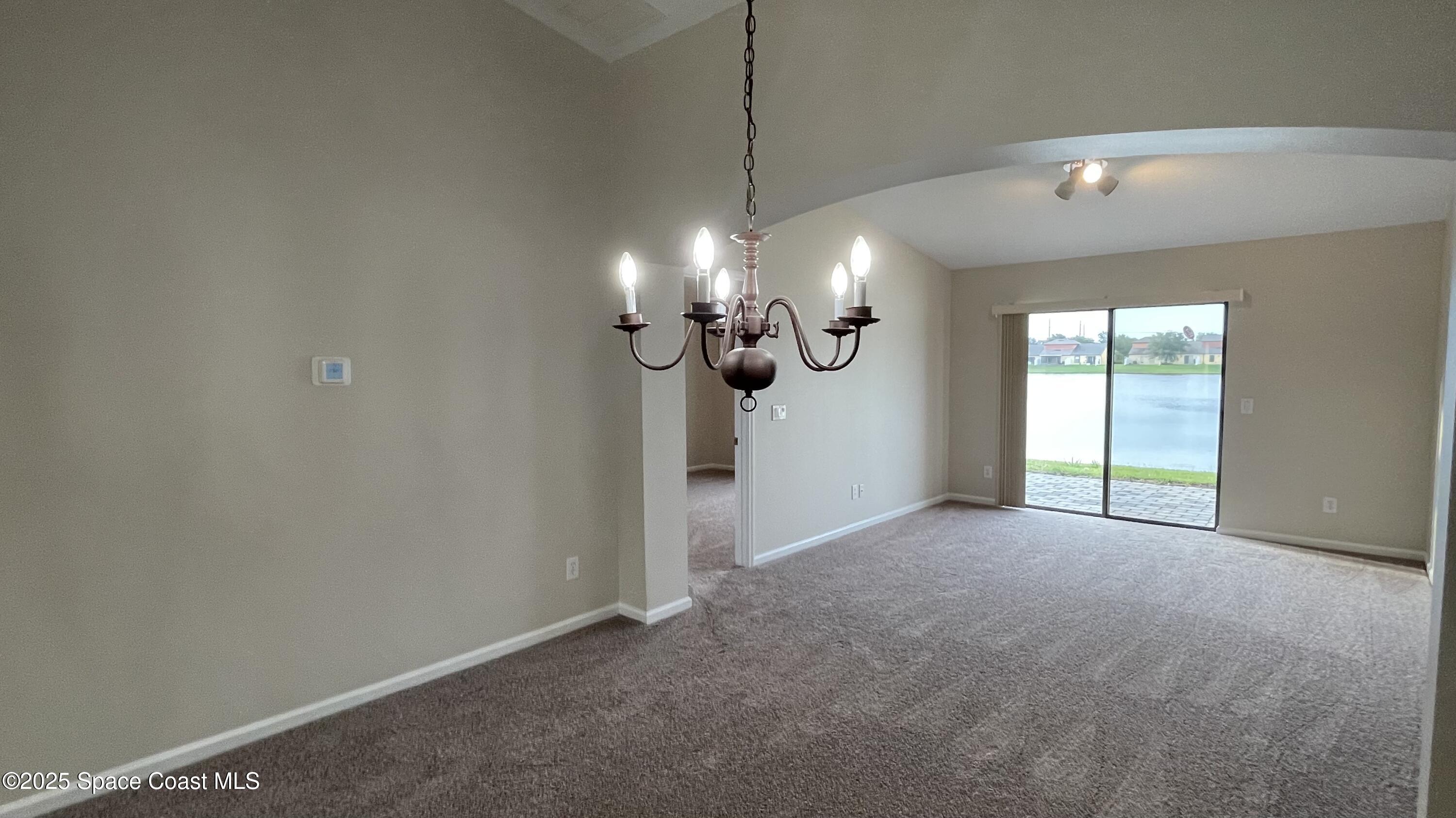 975 Luminary Circle, Unit 103 Melbourne, FL 32901 - Photo 41 of 70 a view of a room with a ceiling fan and window