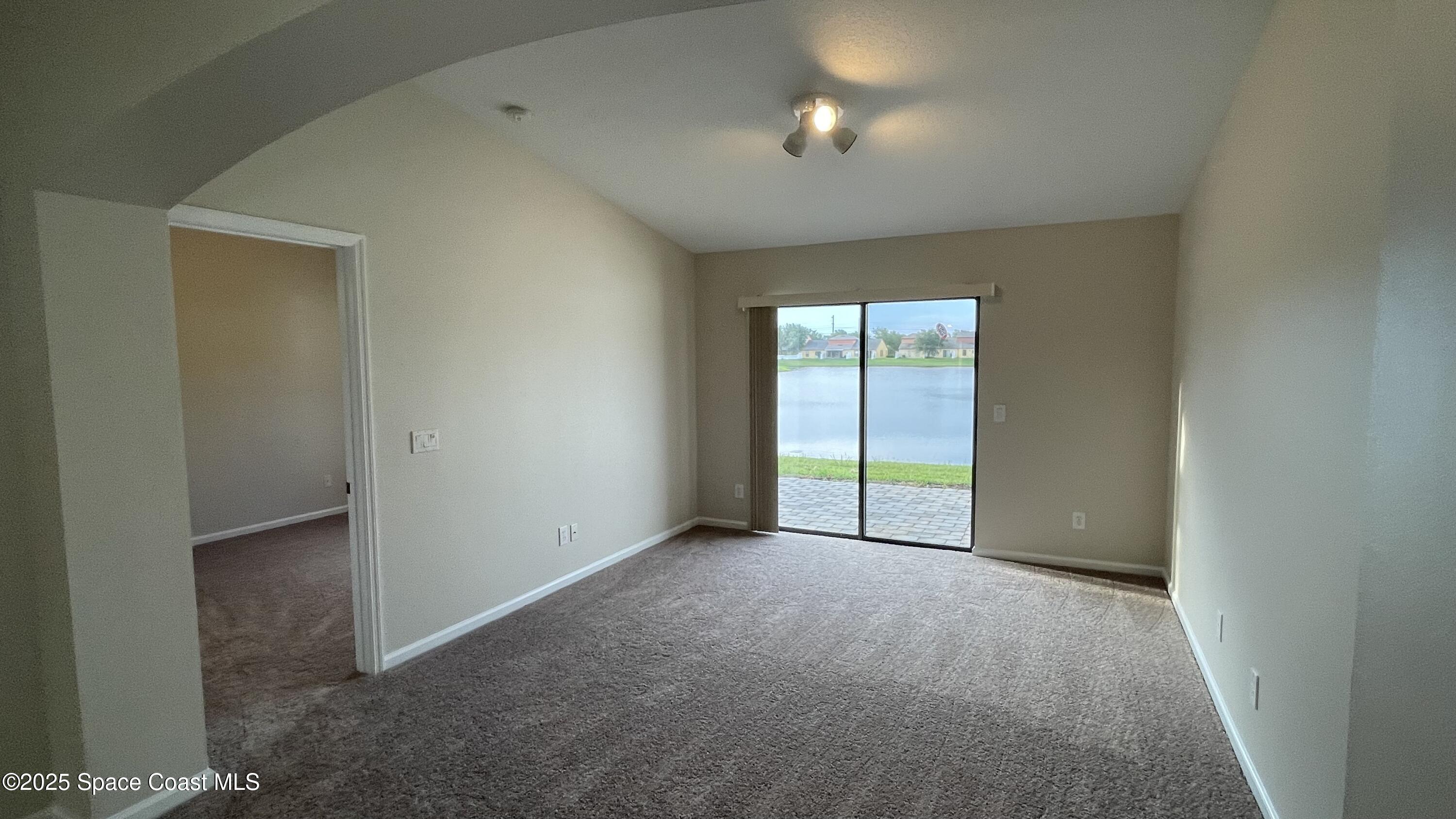 975 Luminary Circle, Unit 103 Melbourne, FL 32901 - Photo 42 of 70 an empty room with windows and closet
