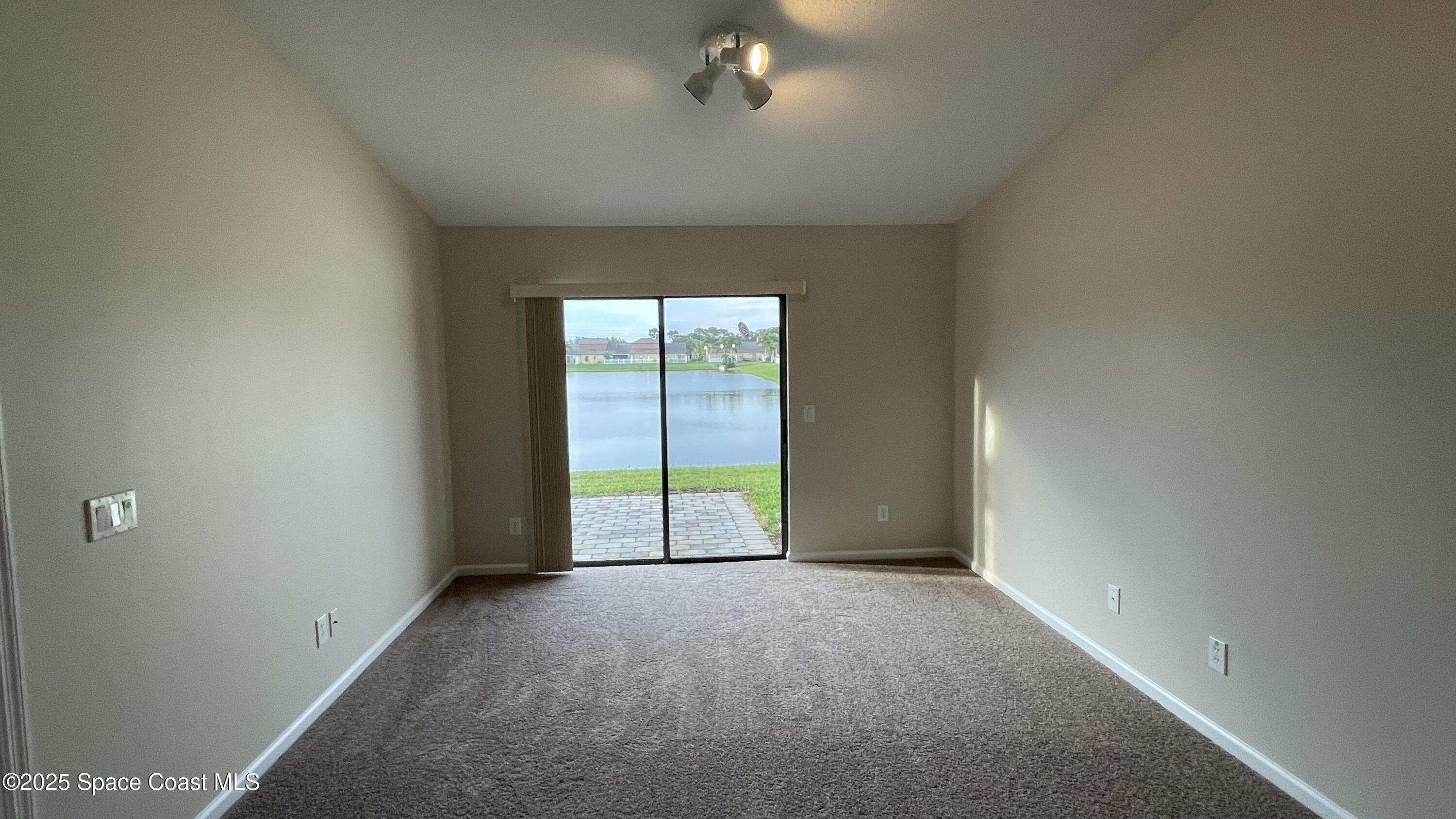 975 Luminary Circle, Unit 103 Melbourne, FL 32901 - Photo 43 of 70 a view of an empty room with a window