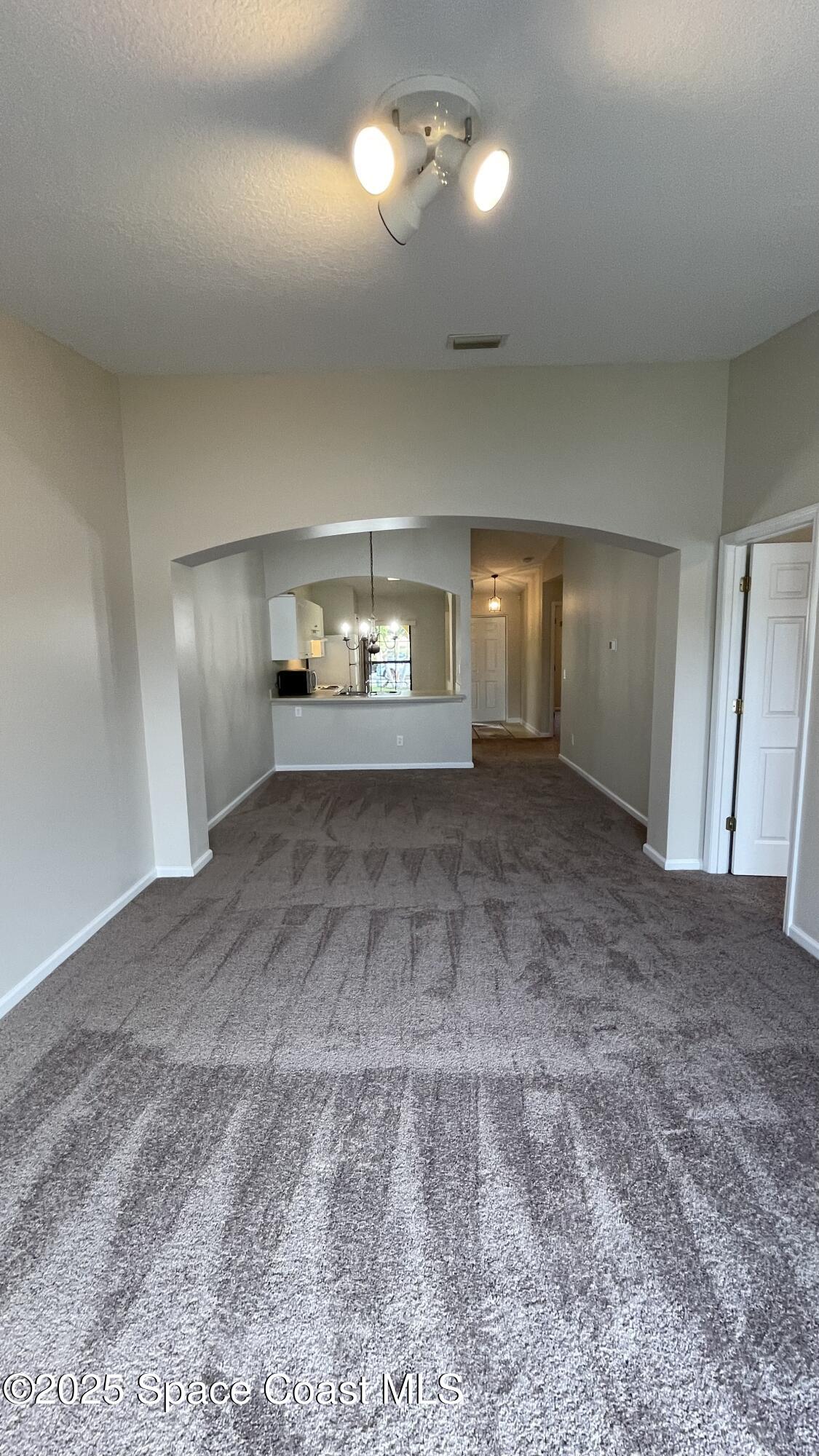 975 Luminary Circle, Unit 103 Melbourne, FL 32901 - Photo 46 of 70 a view of empty room with windows