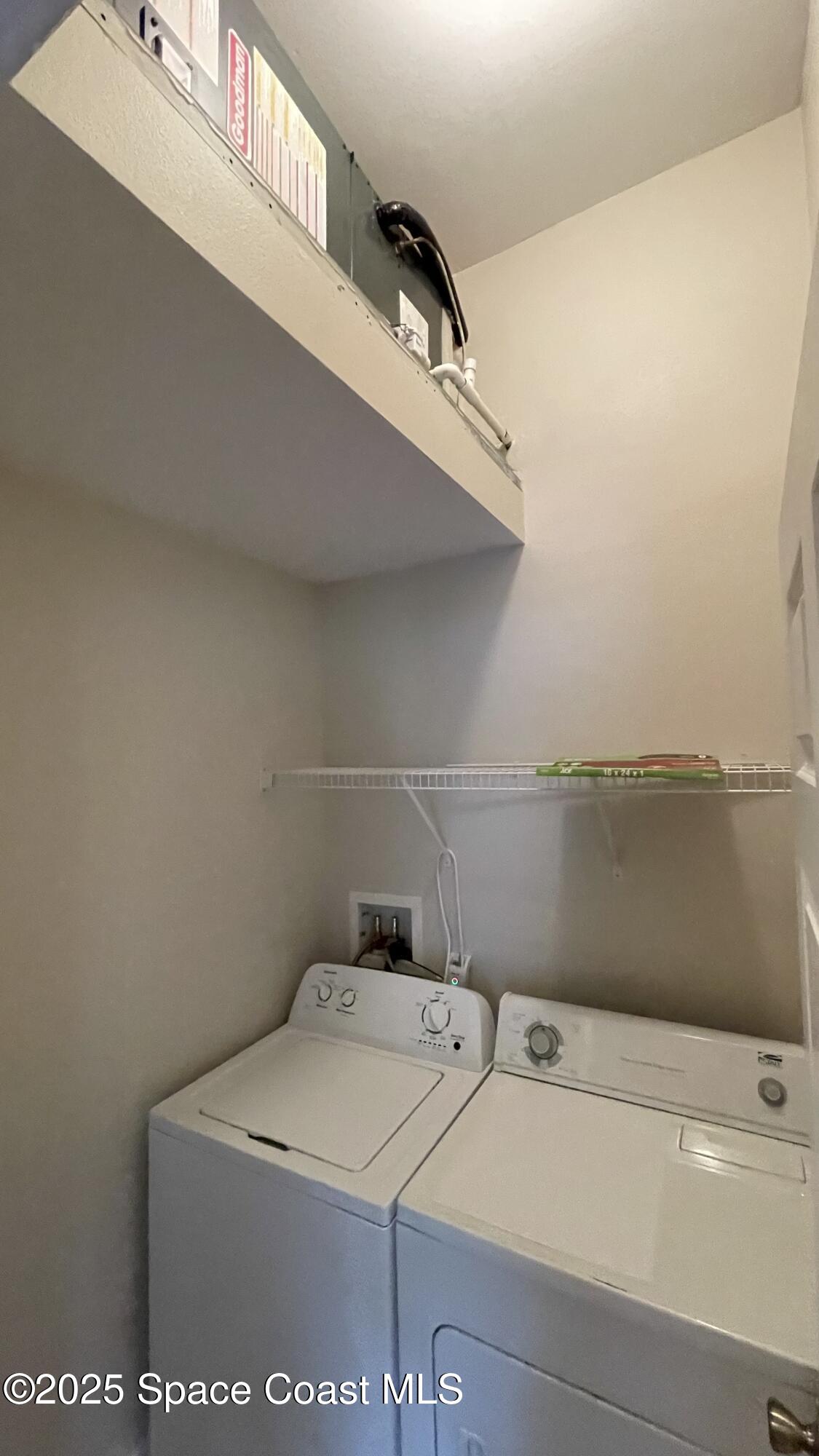 975 Luminary Circle, Unit 103 Melbourne, FL 32901 - Photo 59 of 70 a utility room with dryer and washer